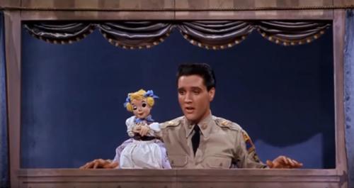 1960 Movie Musical “G.I. Blues” Features Scene Of Elvis Presley Singing “Wooden Heart” With A Puppet